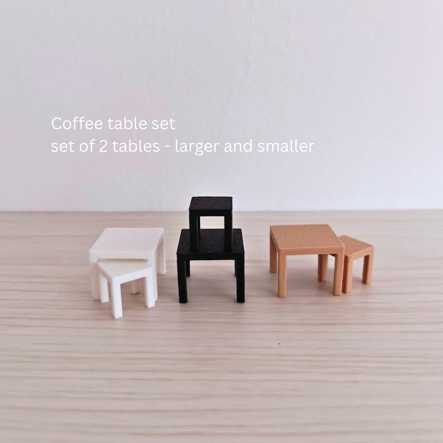 Miniature coffee table set with two matching low tables in black, white and brown.