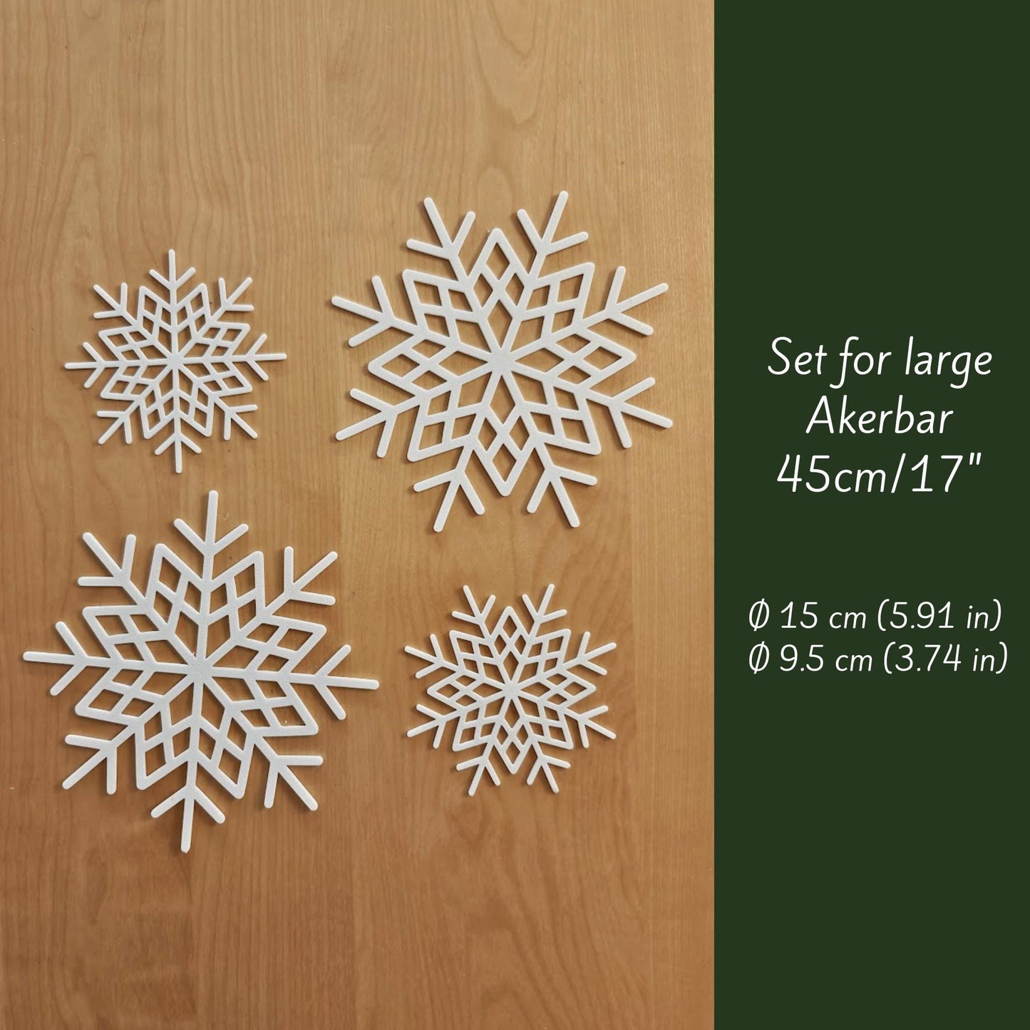 Set of 3D-printed snowflake decorations for large Äkerbar, shown on wooden background with sizes Ø15 cm and Ø9.5 cm.