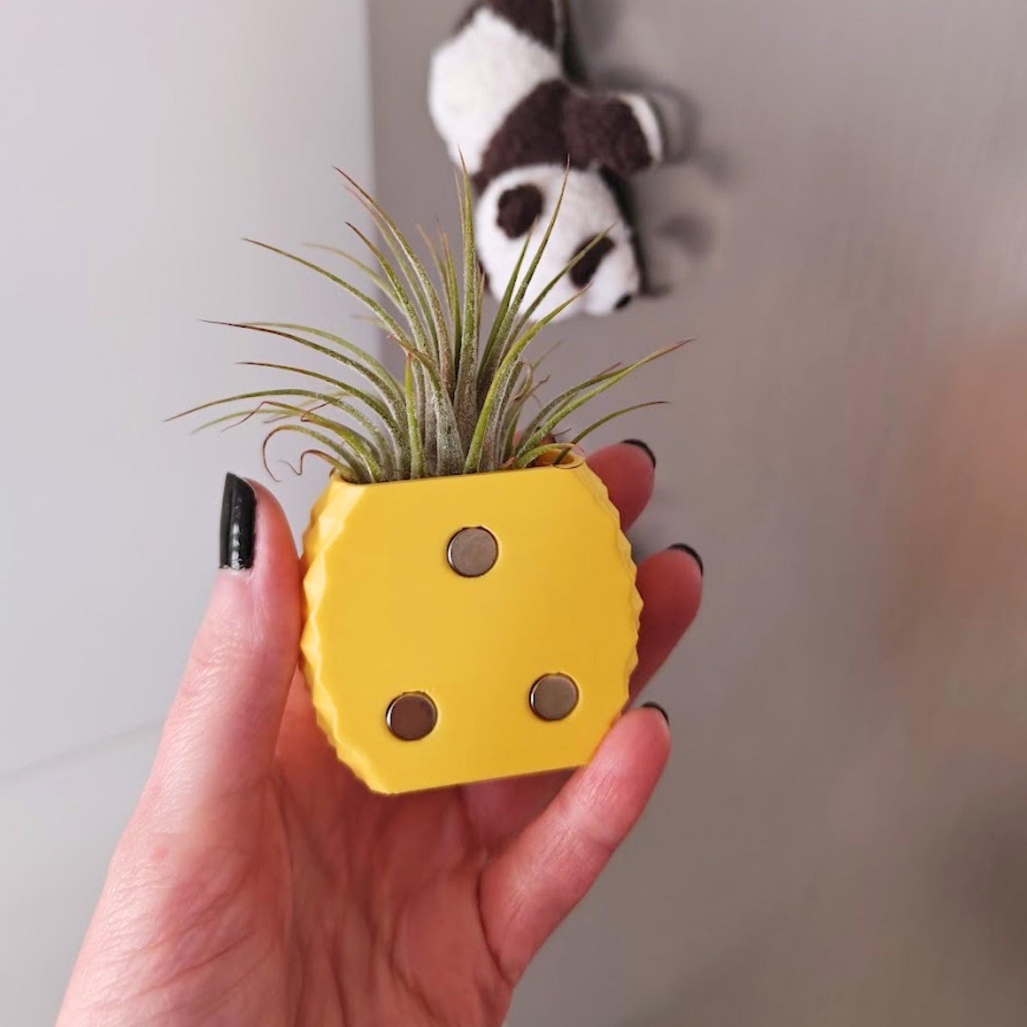 Back view of pineapple magnetic planter showing embedded magnets in base