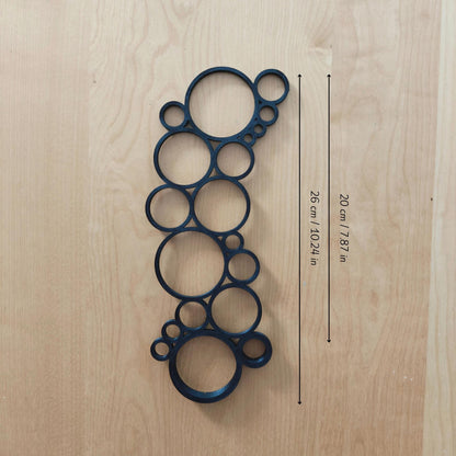 Single circular trellis extension placed on wooden surface with measurement labels