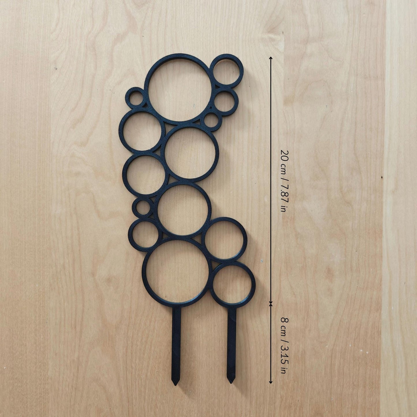 Single circular trellis base module placed on wooden surface with measurement labels