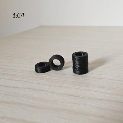1:64 scale miniature tires grouped together showing smallest size option