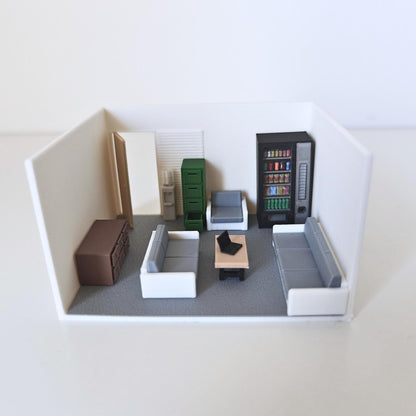Small room diorama with miniature sofa, desk, vending machine and accessories
