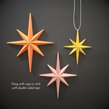 Hanging starburst ornaments displayed with string for tree decoration