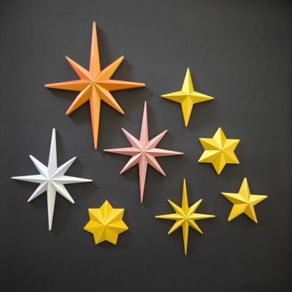 Assorted starburst ornaments in multiple colors for wall and tree decor. More designs available in our shop.
