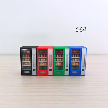 Four 1:64 scale miniature vending machines in blue, green, red, and black arranged in a row on a light wooden background. Each has visible painted snacks and drinks behind clear plastic panels.