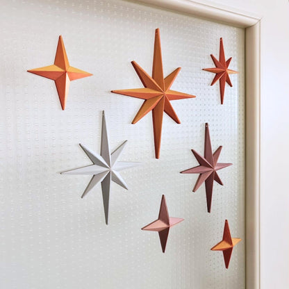 Starburst ornaments in warm metallic tones for retro holiday decor