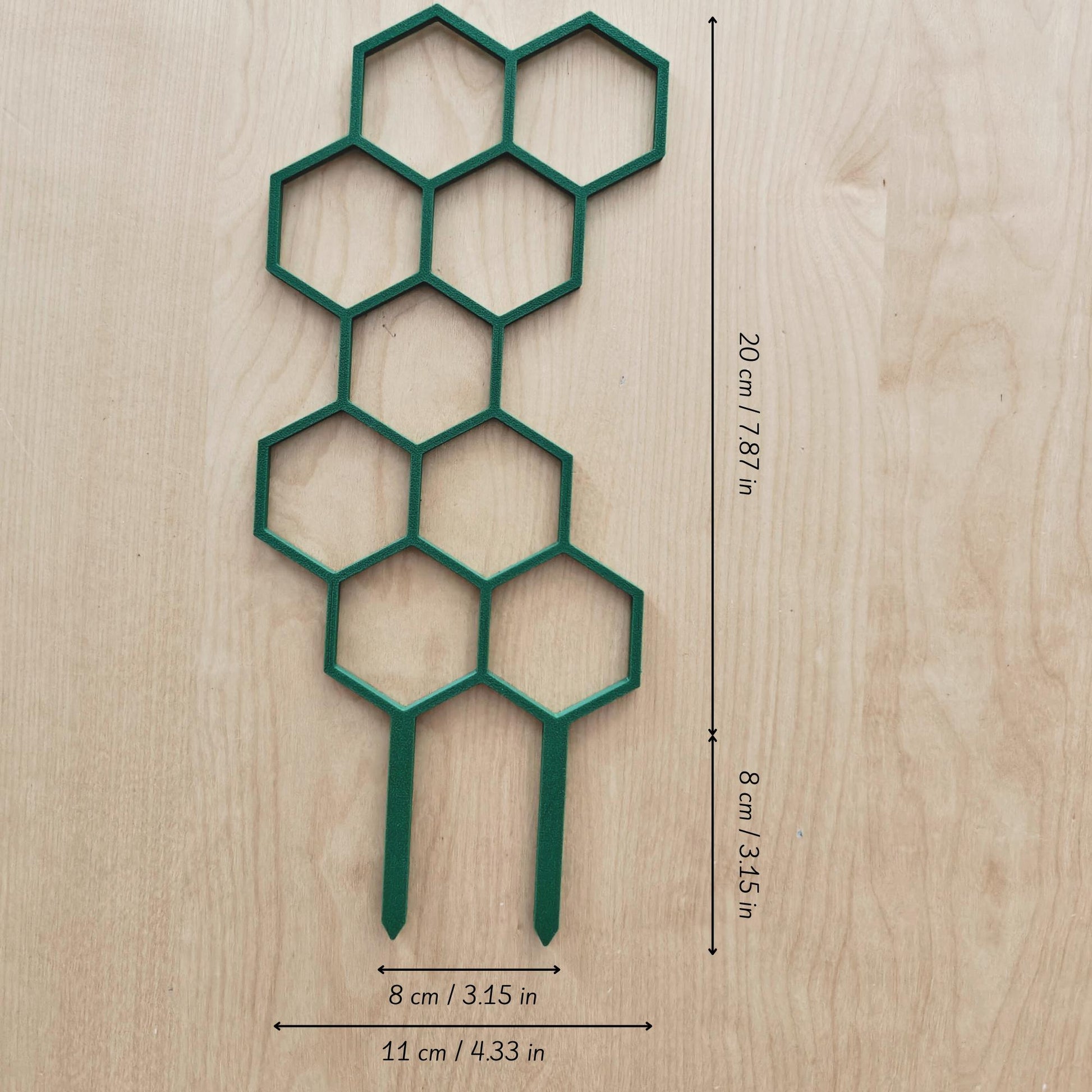 Single short honeycomb trellis segment laid flat on wood surface with marked dimensions
