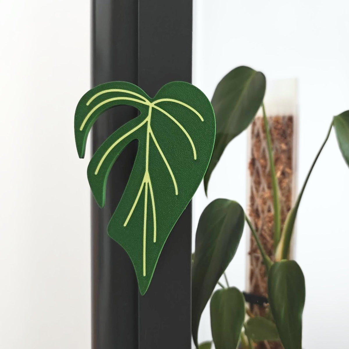 Monstera shaped handle mounted on Ikea Fabrikor cabinet