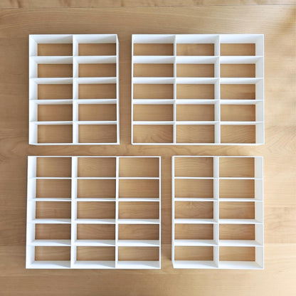 Set of 4 white grid inserts for IKEA Sannahed 50x50 frame laid out on wooden surface