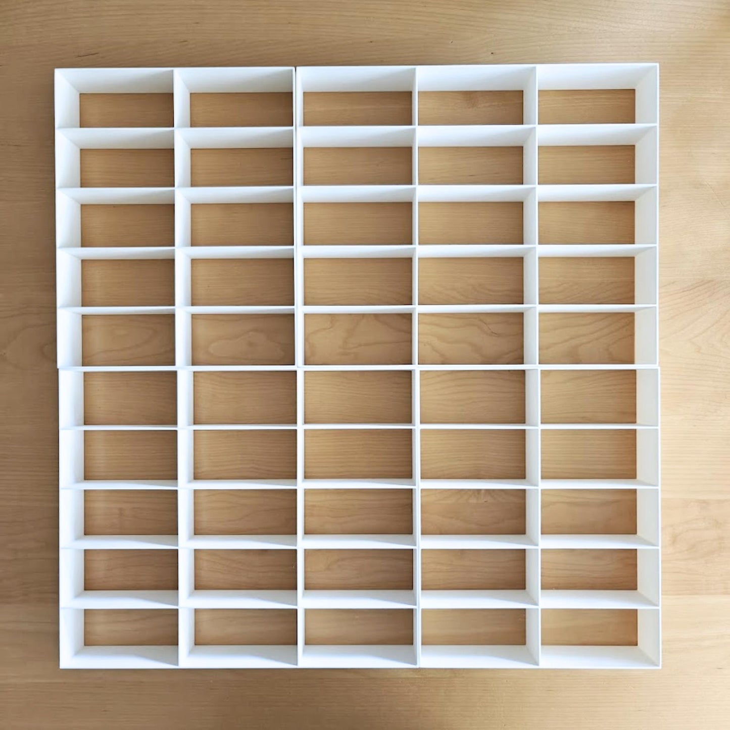 Grid inserts showing 50-slot layout for diecast cars