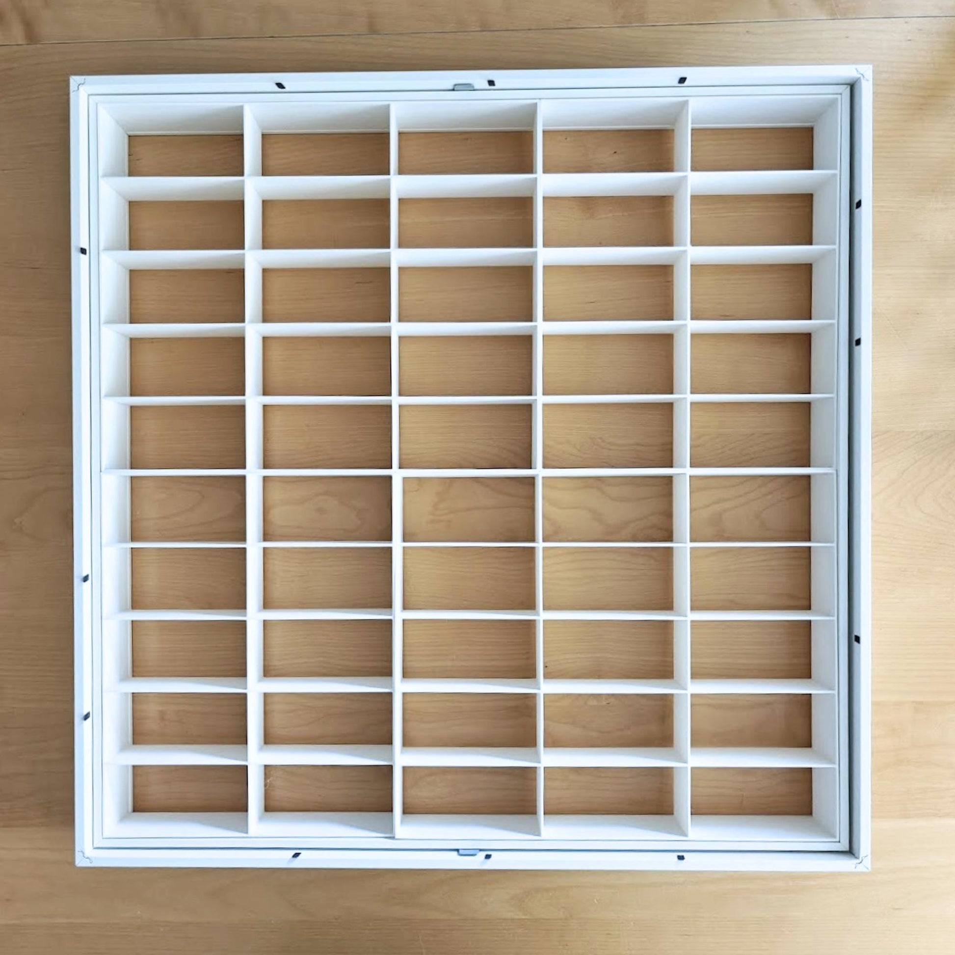 Grid inserts installed inside IKEA Sannahed frame without cars