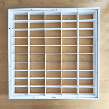 Grid inserts installed inside IKEA Sannahed frame without cars
