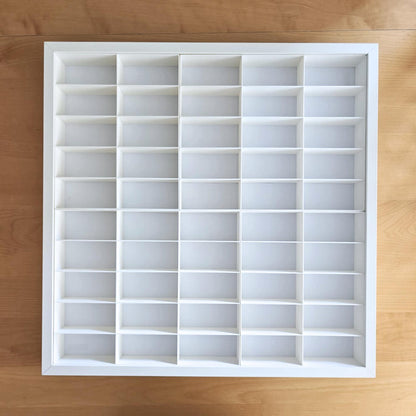 White grid insert inside frame showing empty compartments