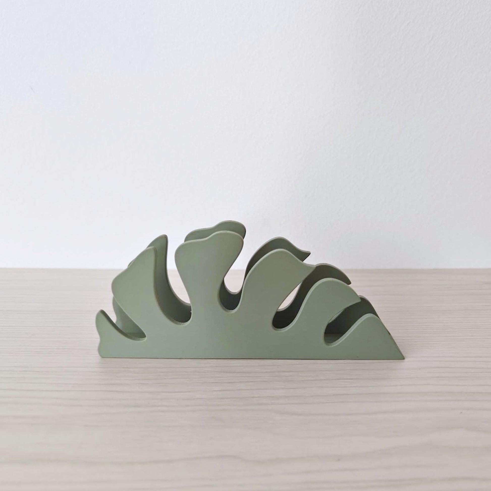 Close-up of monstera leaf napkin holder showing smooth 3D printed finish
