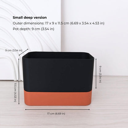 Small deep rectangular self-watering planter assembled in terracotta and black.