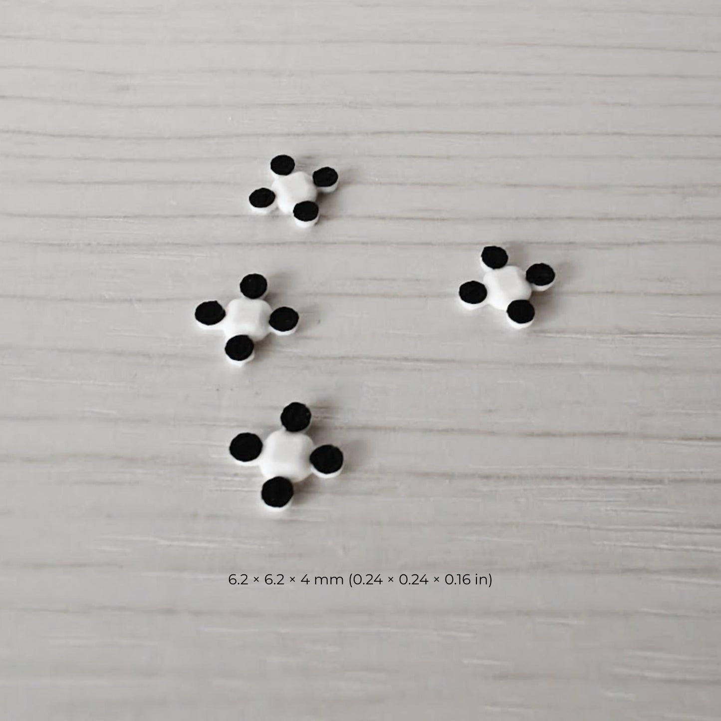 Set of four miniature command drones shown separately with dimensions for scale reference.