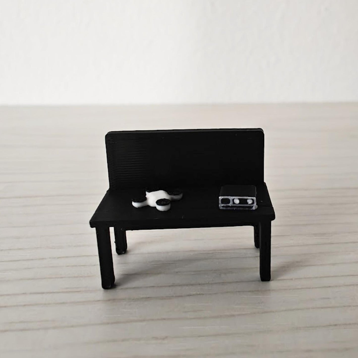 Black version of the miniature firefighter command table displayed with radio and drone accessories