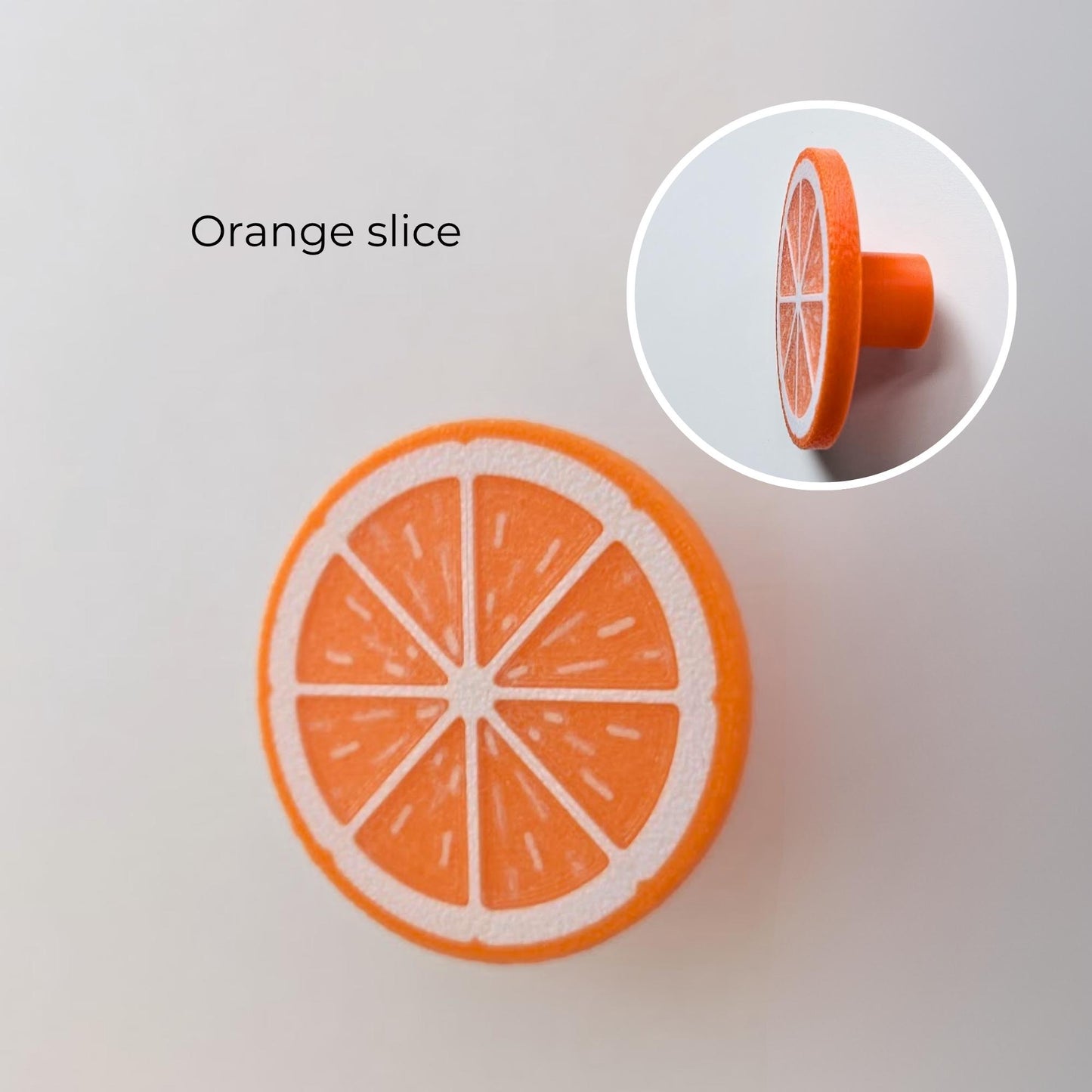 Orange slice citrus knob with flat front design and side profile detail.