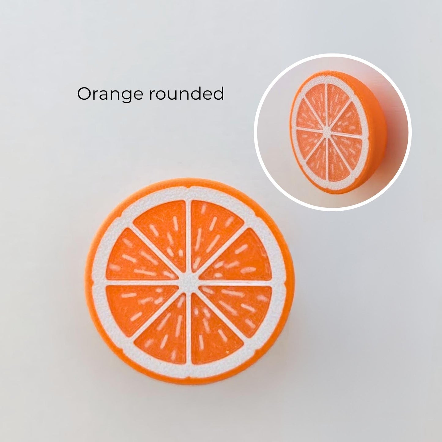 Orange rounded citrus knob with front slice detail and rounded side profile.