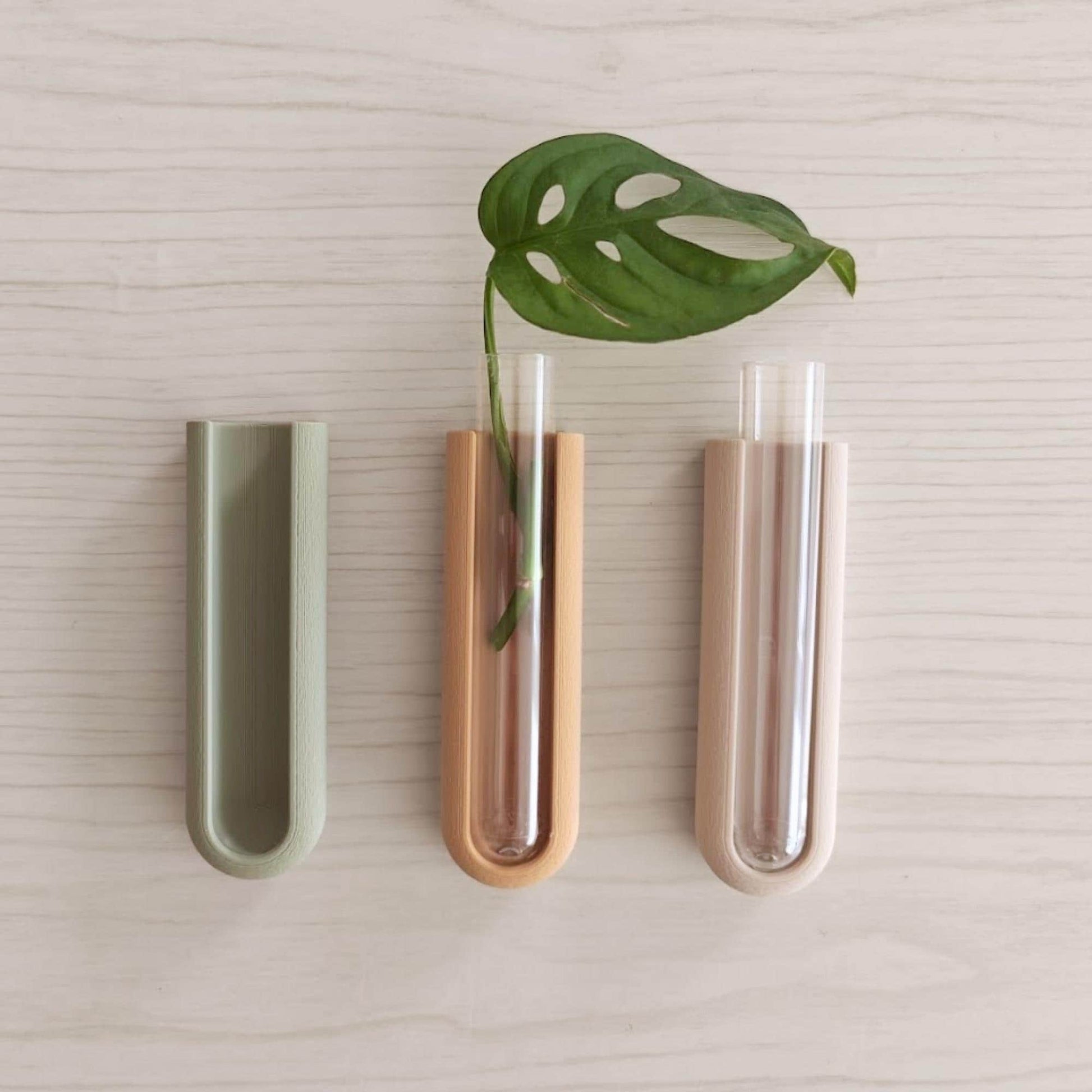Three magnetic propagation holders shown in different colors with included clear test tubes.