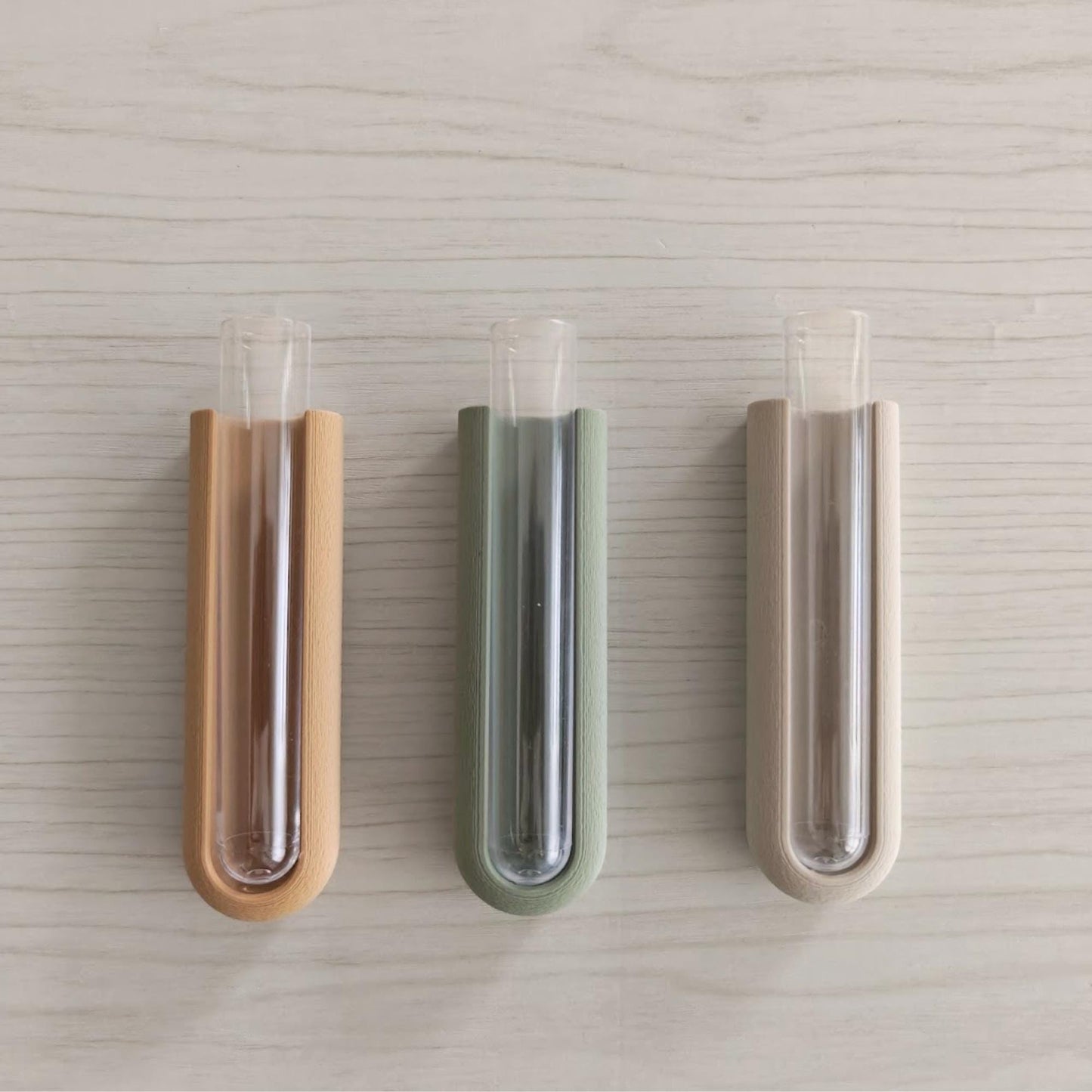 Front view of magnetic plant propagation holders displaying inserted test tubes and color variations.