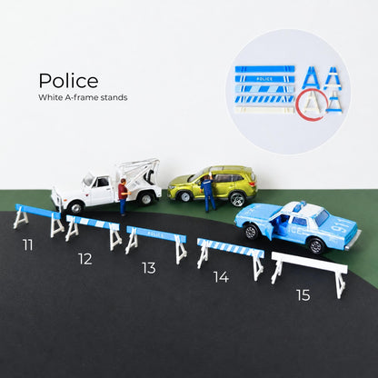White A-frame police barricade stands with blue road barrier bars in miniature diecast display