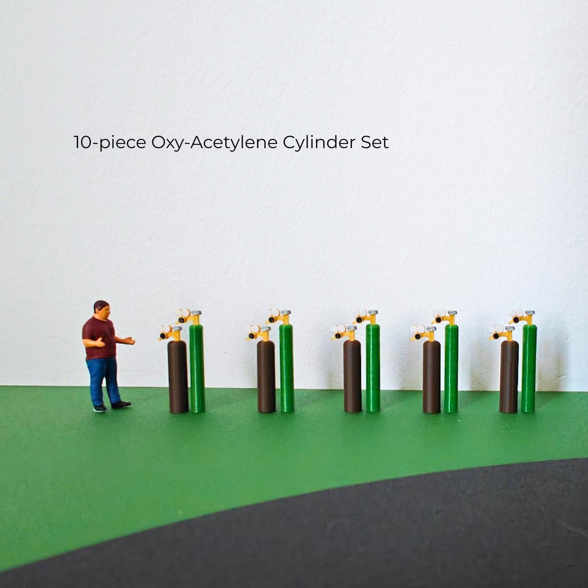 Ten-piece miniature oxy-acetylene cylinder set with five brown and five green gas bottles.