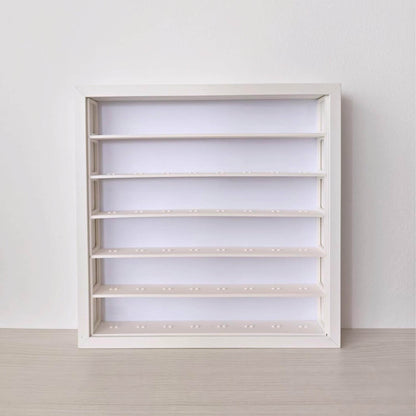 Front view of an empty white SANNAHED frame fitted with the six-row minifigure display insert.