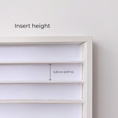Close-up of the white display insert showing 5.25 cm (2.07 in) of space between the shelves.