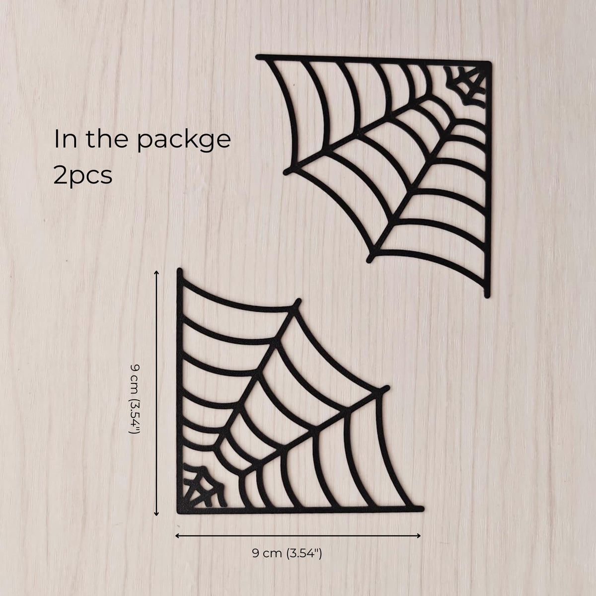 Set of two 3D printed spiderweb corner bookmarks with size reference, approximately 9 × 9 cm each
