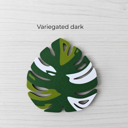 Front view of a Monstera handle - variegated dark version