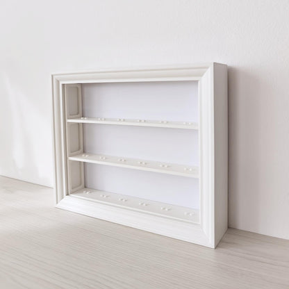 Angled view of empty horizontal IKEA VÄSTANHED frame with 3D printed shelf inserts.