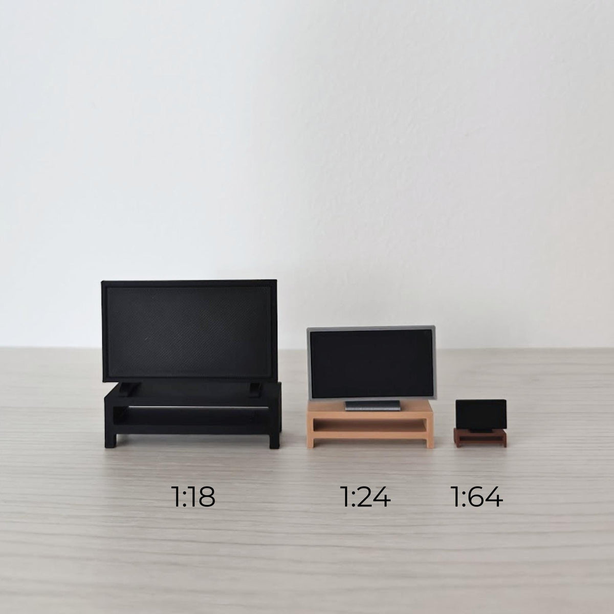 Miniature TV and stand shown side by side in 1:18, 1:24 and 1:64 scales.