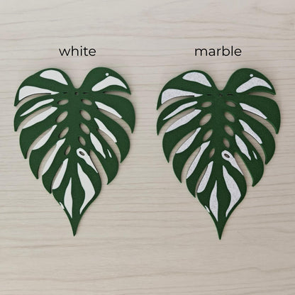 Monstera Devil Monster leaf coaster comparison showing white and marble variegation options