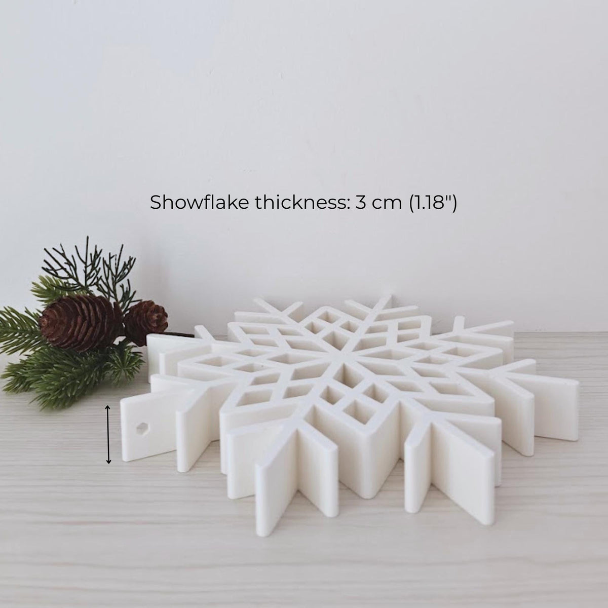 Large snowflake decoration shown from the side with 3 cm thick sculptural profile